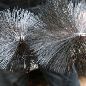 a close up view of two chimney sweep brushes