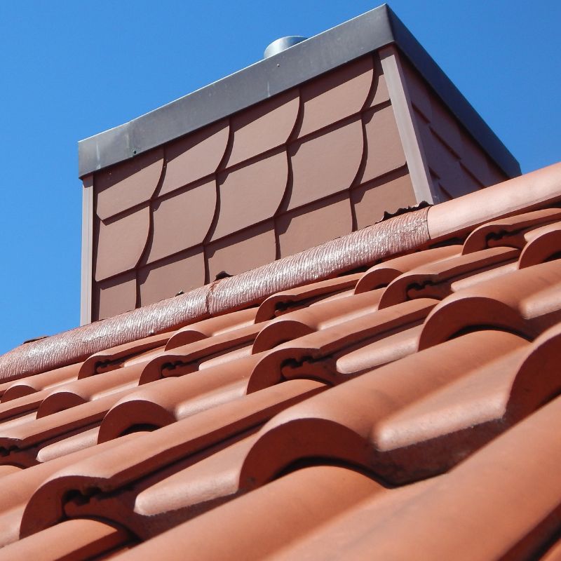 a upward-looking view of a chimney chase with a chase cover